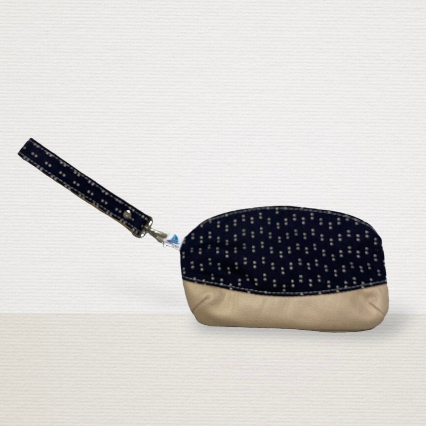 Black and white polka dot clutch bag on sale